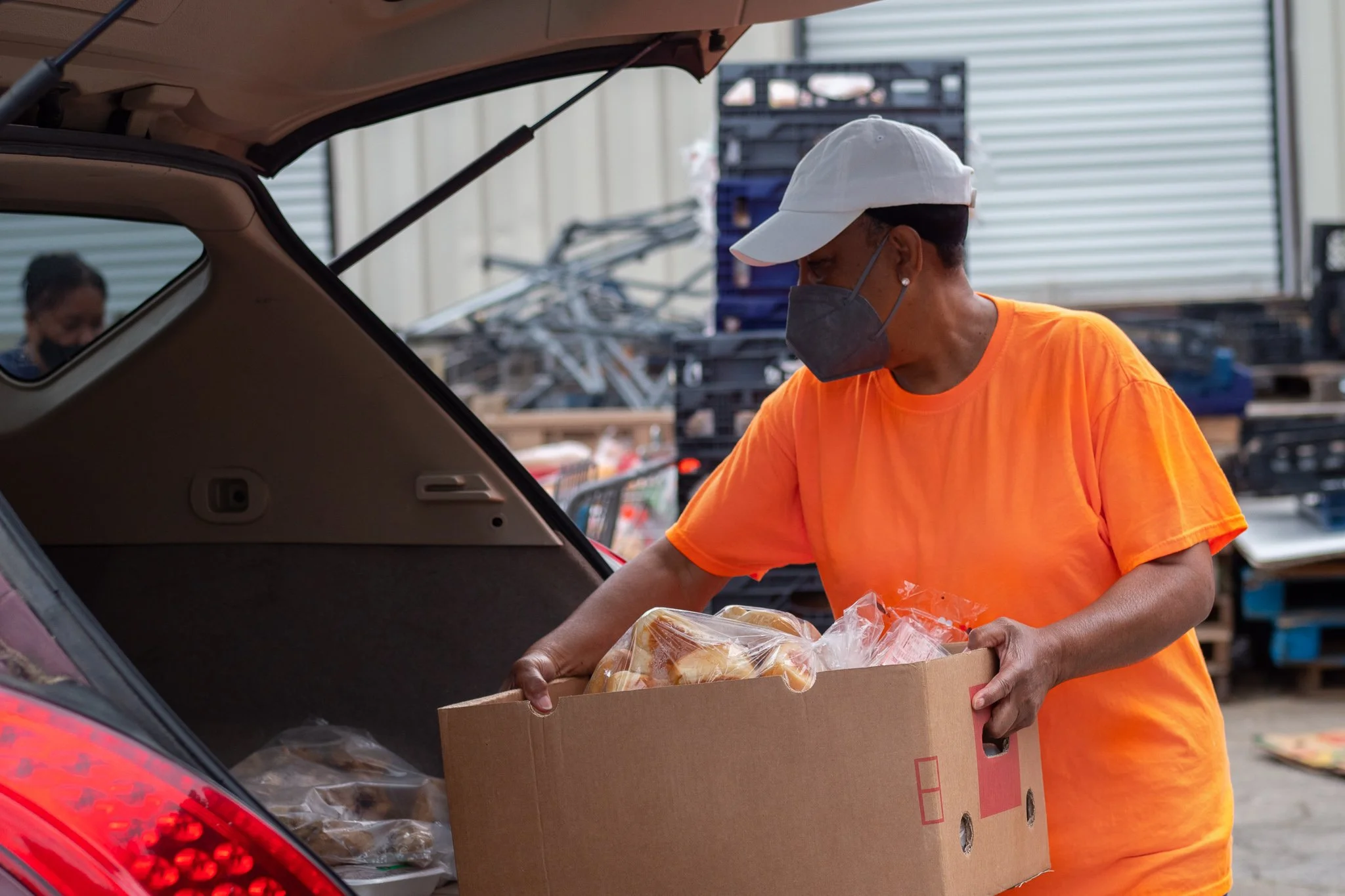 Hearts to Nourish Hope volunteers and neighbors